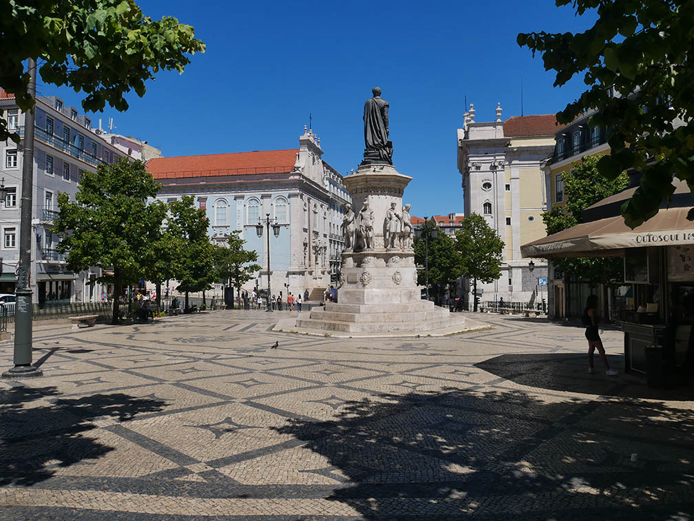 paved square with stars and statue of Luís de Camões 